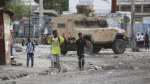 Gunfire paralyzes Haiti as powerful gang leader says he will try to detain police chief ministers The Associated Press Gunfire paralyzes Haiti as powerful gang leader says he will try to detain police chief ministers The Associated Press